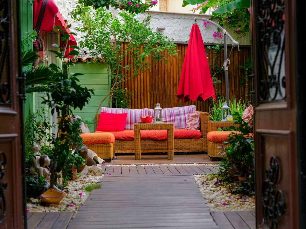 a patio with a couch and chairs